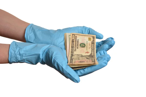 白い背景に隔離されたお金と青の保護手袋で手 — ストック写真