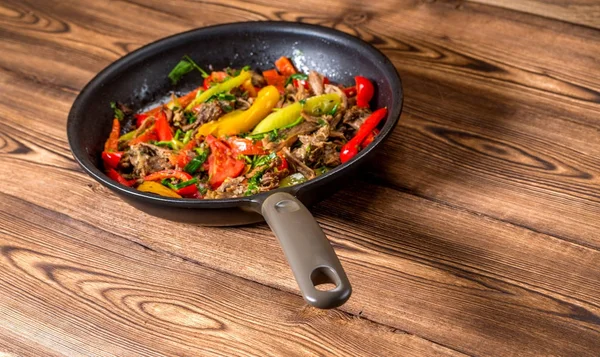 Stir frying beef with sweet peppers and green beans. Top view Royalty Free Stock Photos