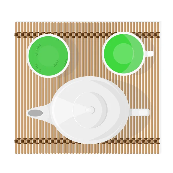 Çay seremonisi için bir çaydanlık ve iki fincan koyu yeşil çay..