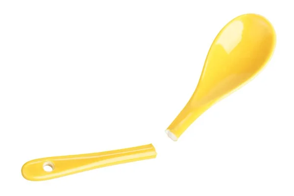 Broken yellow ceramic spoon — Stock Photo, Image