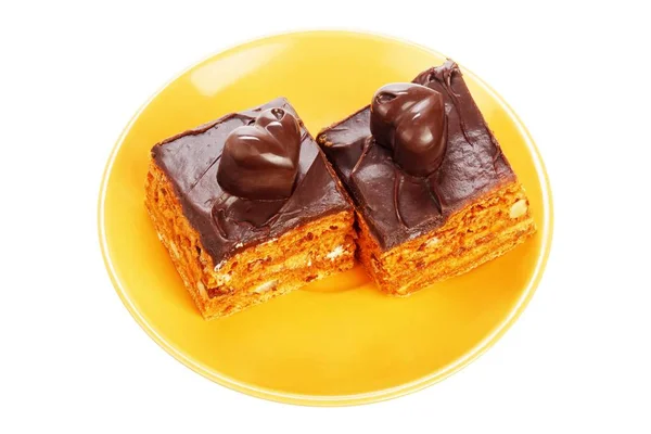 Dos pasteles de chocolate en plato naranja —  Fotos de Stock