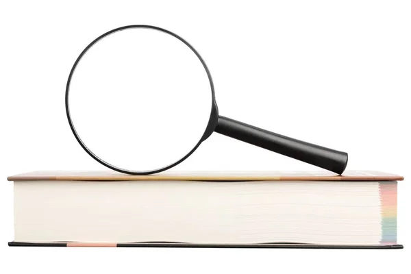 Magnifying glass and book — Stock Photo, Image