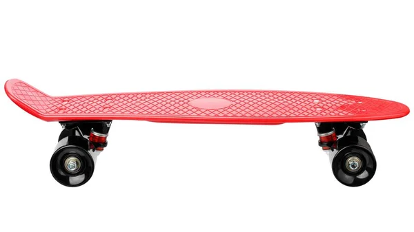 Красный пластиковый скейтборд — стоковое фото