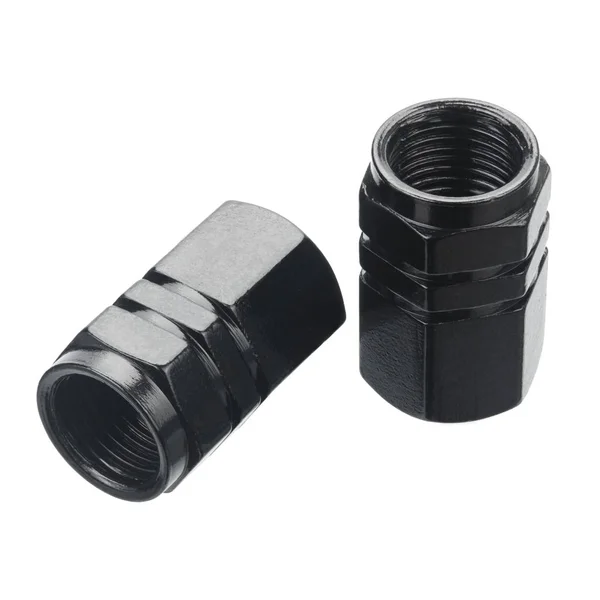 Černé hliníkové krytky na pneumatikové ventily — Stock fotografie