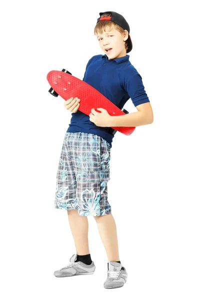 Teenage boy gesturing with a skateboard, as if playing the guitar — Stock Photo, Image