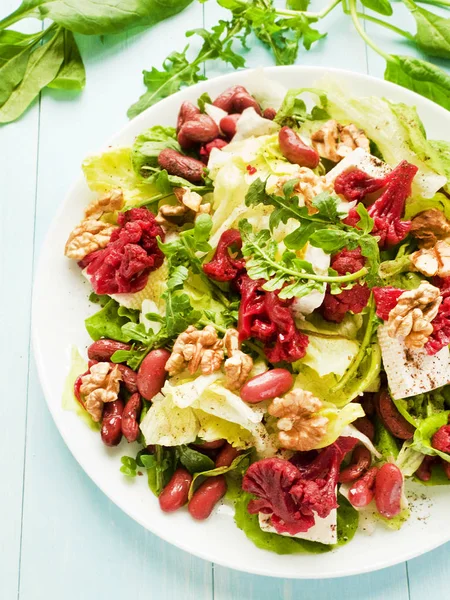 Salad with walnuts and various herbs — Stock Photo, Image