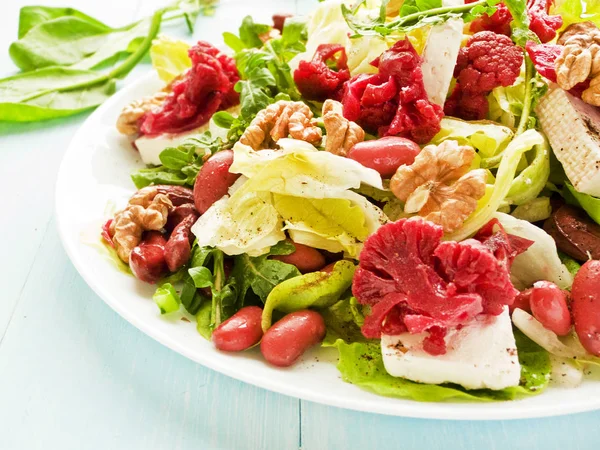 Salad with walnuts and various herbs — Stock Photo, Image
