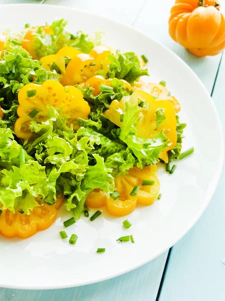Yellow tomatoes salad — Stock Photo, Image