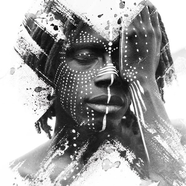Paintography of african american man with traditional style face paint dissolving behind smoky and ink texture