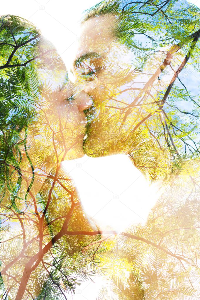 Double exposure of two blissful people with wet black hair kissing, summer love concept 