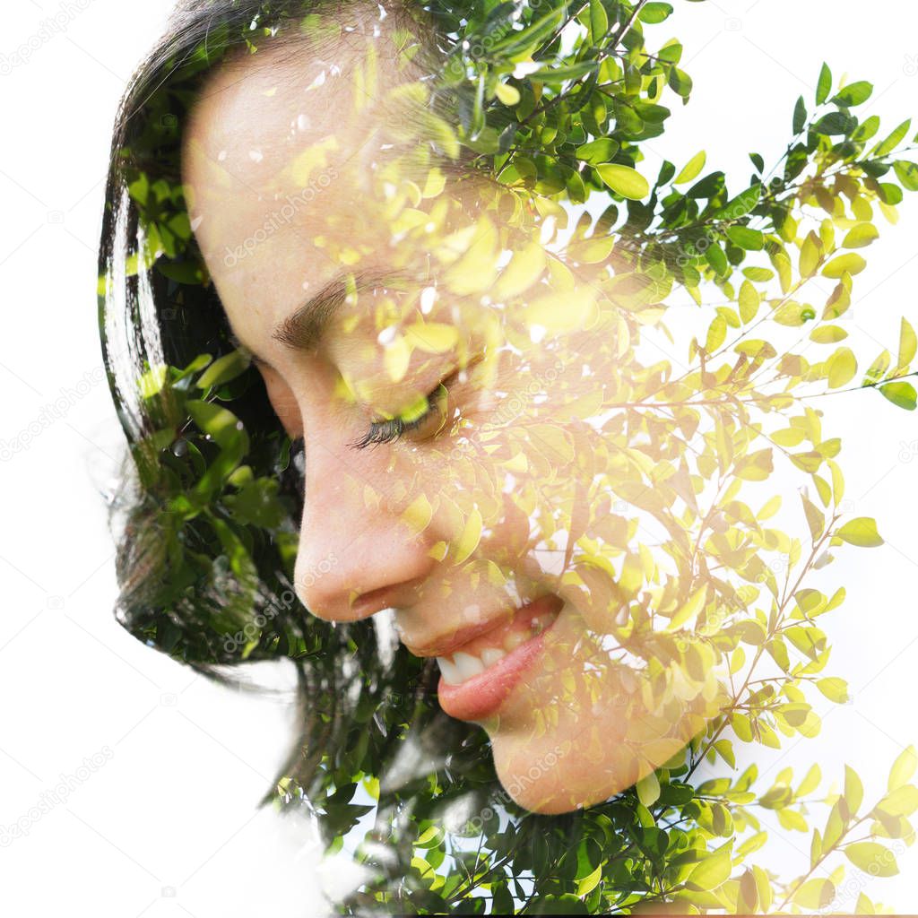 Double exposure profile portrait of a happy woman looking down c