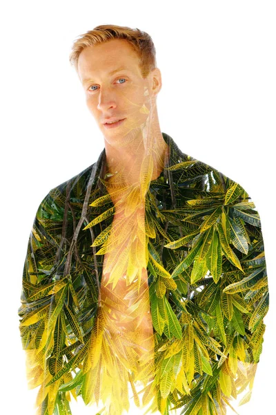 Double exposure, of a young muscular man with an open shirt combined with bright tropical leaves — Stock Photo, Image