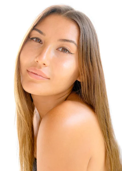Portrait of an exotic asian beauty with long brown hair and shoulder facing the camera — Stock Photo, Image