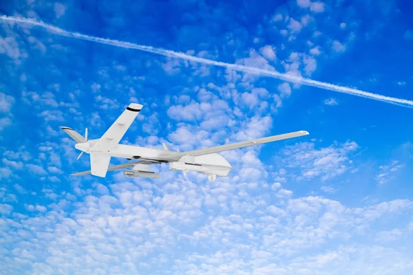 military RC military drone flies against the backdrop of blue peaceful sky with white clouds