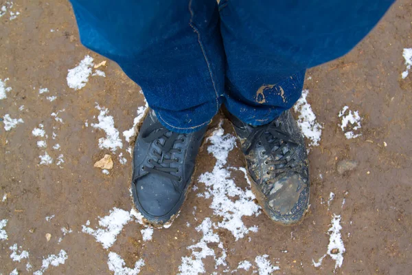 Top View Black Boots Legs Blue Jeans All Covered Mud — Stock Photo, Image