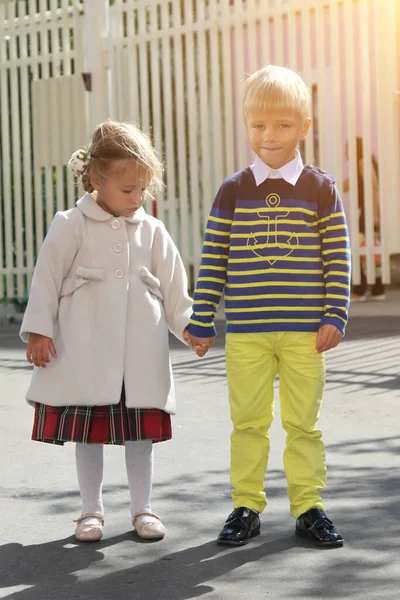 Adorable Little Girl Coat Holds Boy Hand Kindergarten Sunny Day — Stock Photo, Image