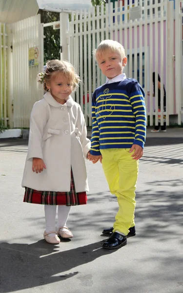 Adorable Little Girl Coat Holds Boy Hand Kindergarten Sunny Day — Stock Photo, Image