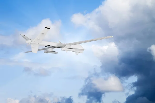 military RC military drone flies against the backdrop of blue peaceful sky with white clouds