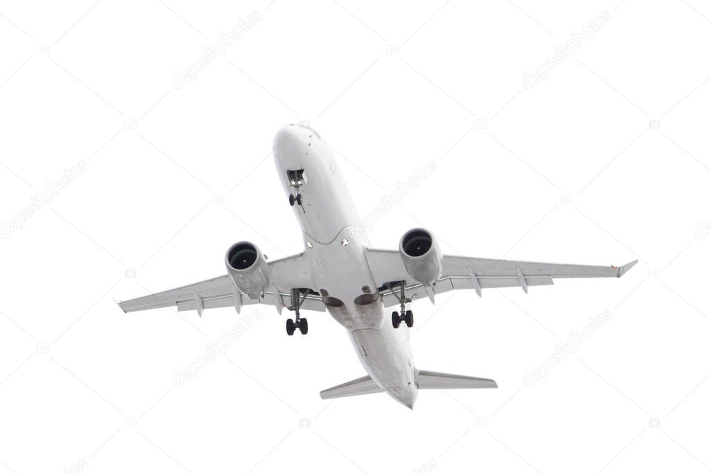 white passenger plane has released its landing gear and is landing isolated on white background with cliping path