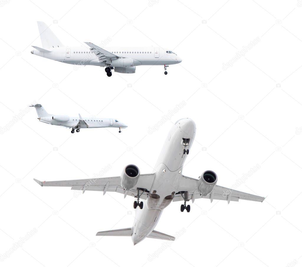three white passenger planes has released its landing gear and is landing isolated on white background with cliping path