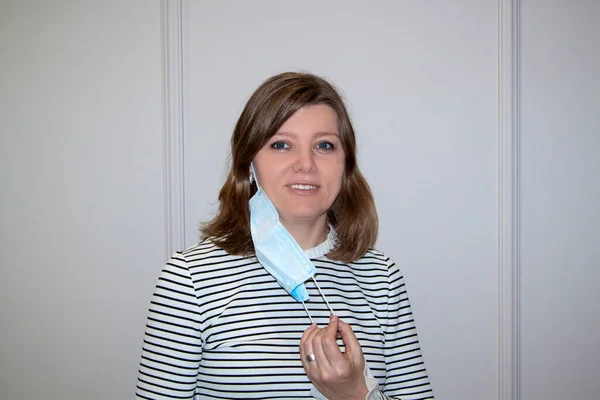 Close-up of woman wearing an anti-virus protection mask to prevent flu infection, allergies, virus protection, COVID-19, and corona virus pandemic disease 2019