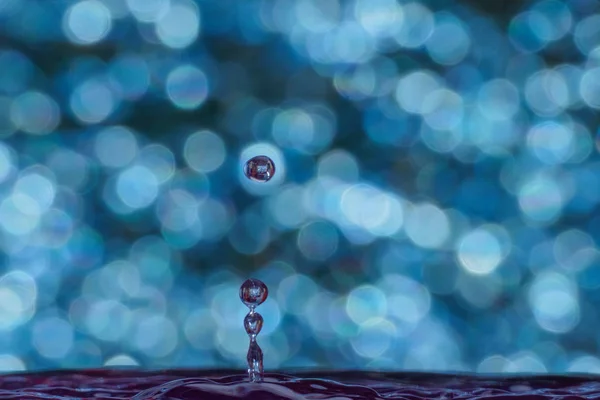 Gota de água e bokeh — Fotografia de Stock