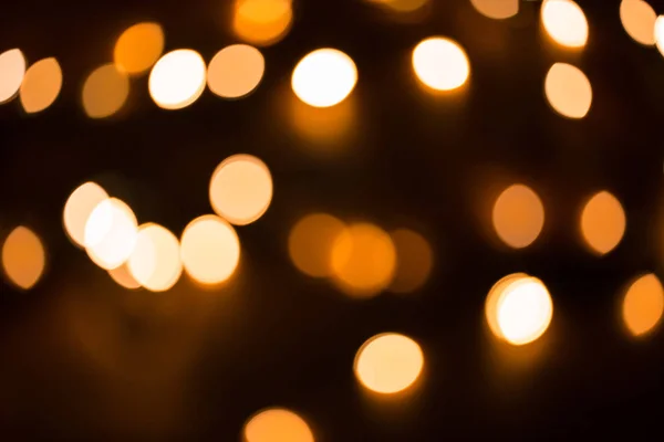 Rozmyte złota Boże Narodzenie światła świecidełka — Zdjęcie stockowe