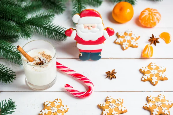 Gingerbread Santa Claus with glass of milk — Stock Photo, Image