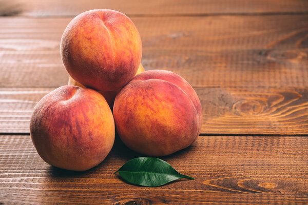 peaches on wooden background
