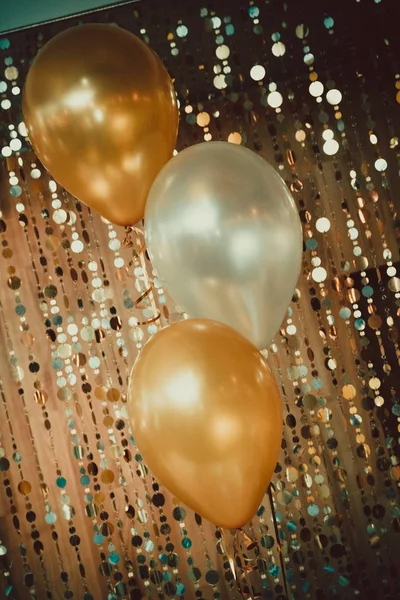 gold balloons and brilliant decor