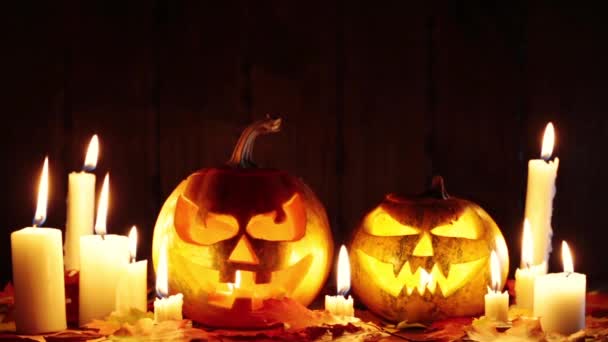 Halloween pumpkins with glowing faces — Stock Video