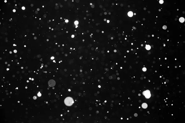 Falling snow on black background. — Stock Photo, Image