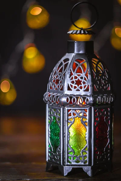 The Muslim feast of the holy month of Ramadan Kareem. Beautiful background with a shining lantern Fanus. Free space for your text.