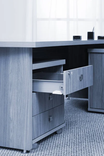 Desk with an open drawer — Stock Photo, Image