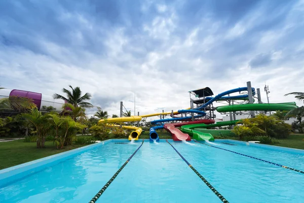 Waterslides in tropical aqua park — Stock Photo, Image