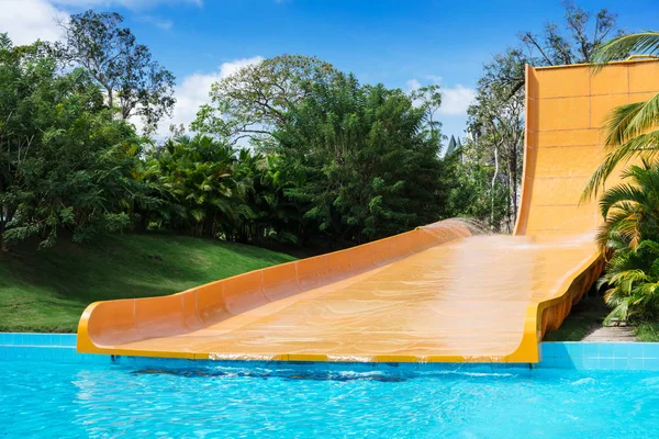 Yellow water slides in aqua park — Stock Photo, Image