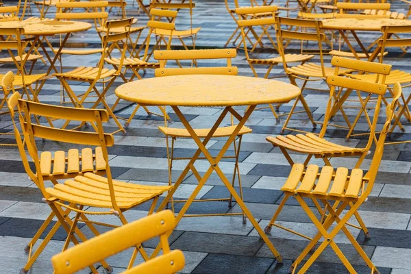 Tables and chairs in a cafe on street — Stock Photo, Image