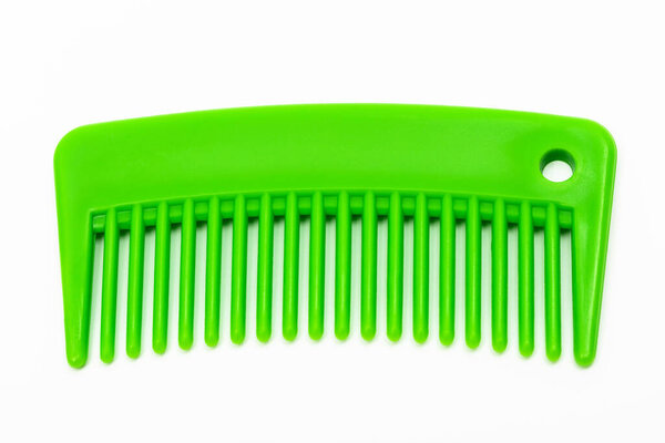new green comb on a white background