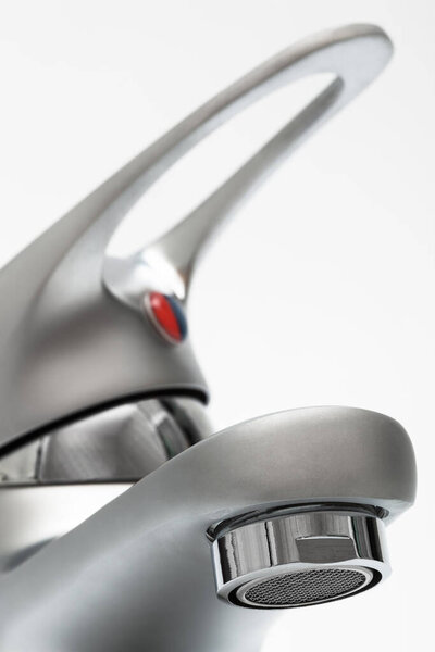 a modern faucet on a white background