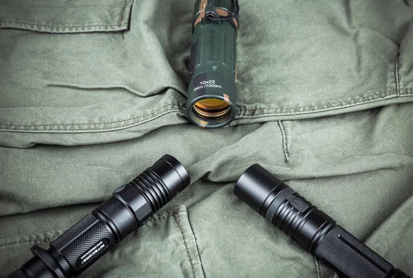 Military paracord bracelet, tactical torch and spy-glass — Stock Photo, Image