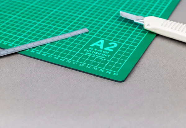 Cutting mat with ruler and cutter — Stock Photo, Image