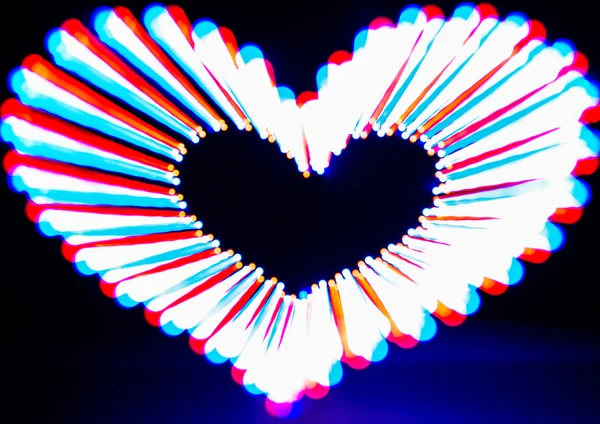 Glowing heart on dark — Stock Photo, Image