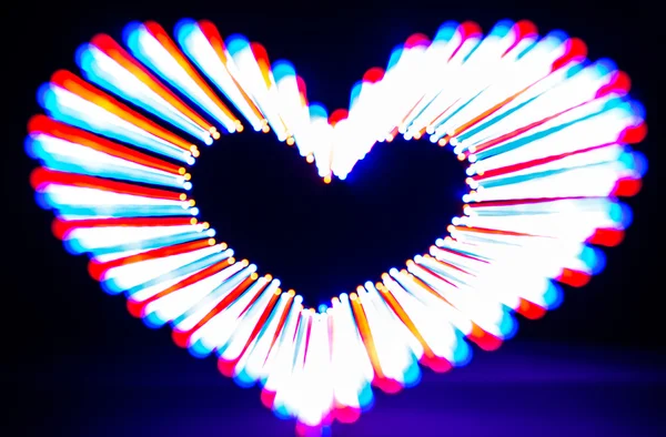 Glowing heart on dark — Stock Photo, Image