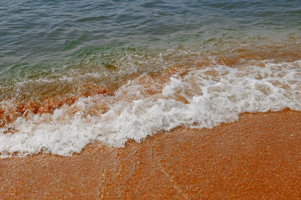 Hullám és a homokos strand háttér, színes festői képet utazási koncepció — Stock Fotó