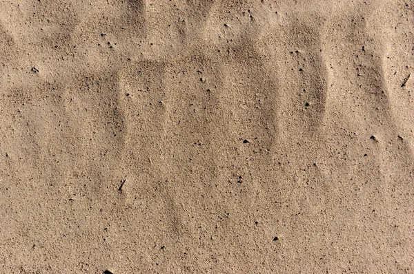 Sandy beach bakgrund sommar tema. Sand konsistens. Makro skott av sand med väver — Stockfoto