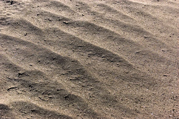 Podłoże piasek. Sandy beach tekstura makro strzał. Dużo miejsca na kopię — Zdjęcie stockowe