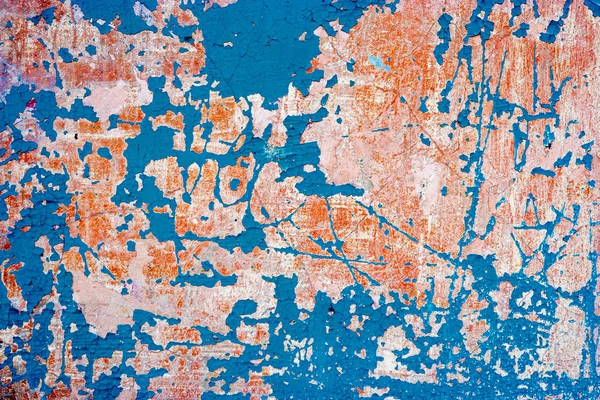 Abandoned wall with blue paint on. Grungy background with weathered plaster and destroied paint — Stock Photo, Image