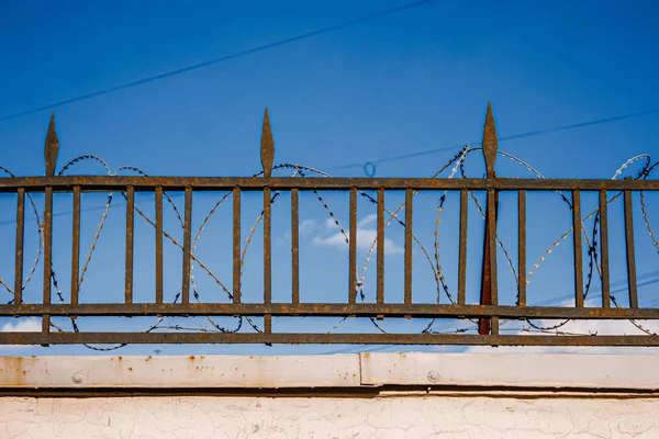 Spices of fence with barbed wire — Stock Photo, Image