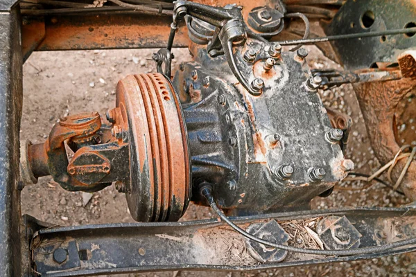 Part of the old rusty truck, cardan shaft or universally jointed shaft — Stock Photo, Image