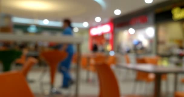 Out of focus footage inside food court restaurant — Stock Video